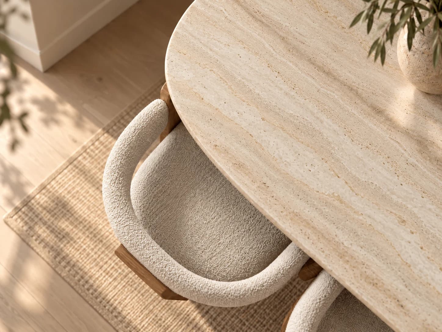 Nuvé curved dining chair beneath a stone dining table