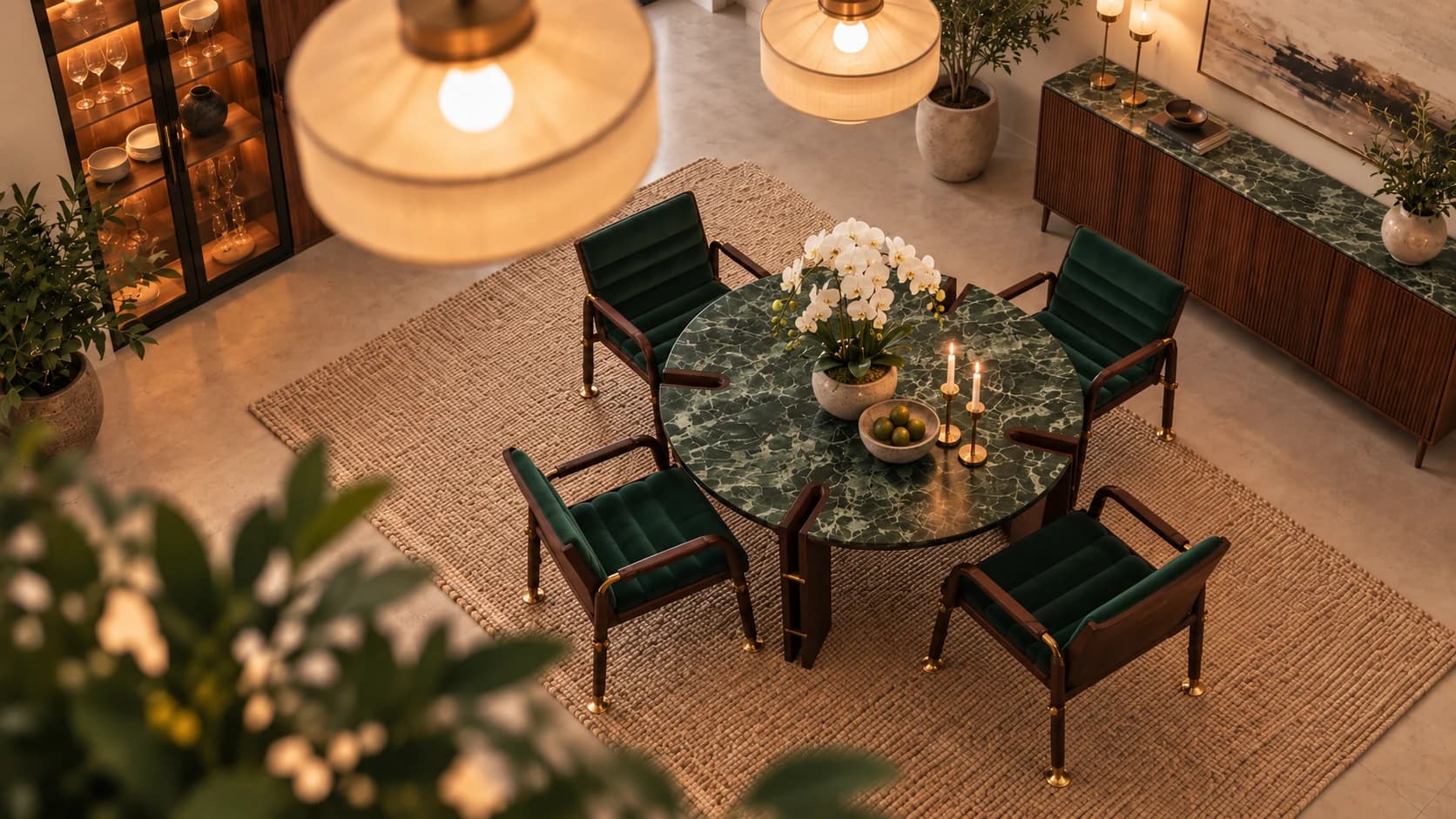 Ravenscroft green dining chairs around a round dark stone table