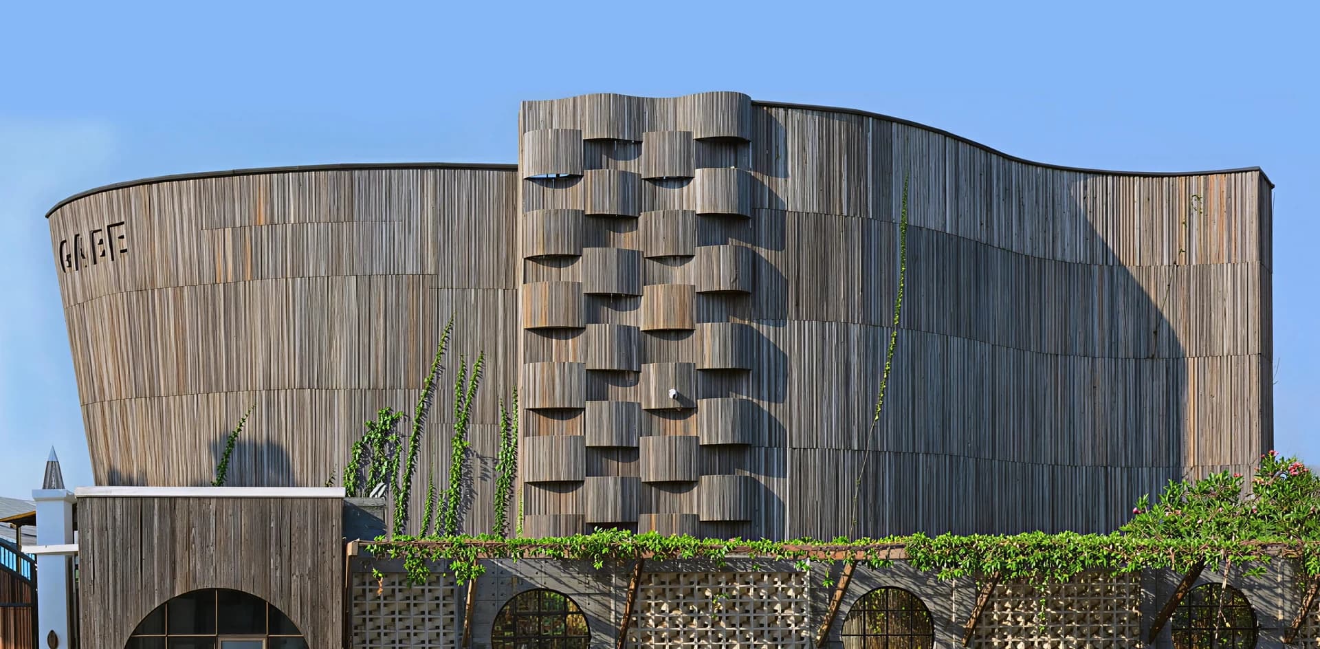 Contemporary GABE building facade with curved wooden detailing